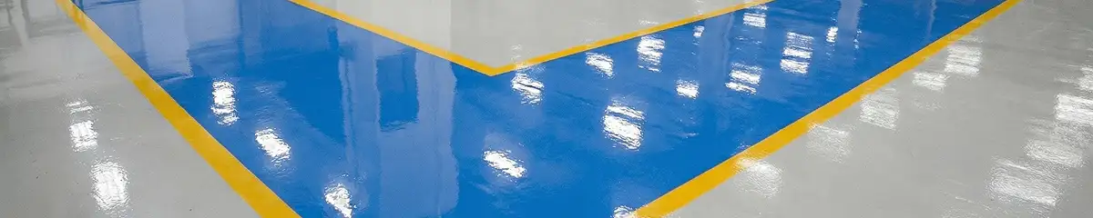 A factory floor professionally covered and marked with epoxy flooring in Nashua, NH