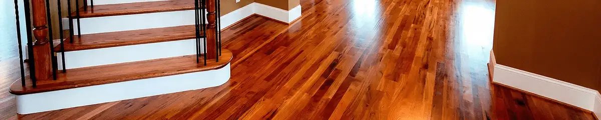 Base floor of a staircase with professionally restored wood flooring in Nashua NH