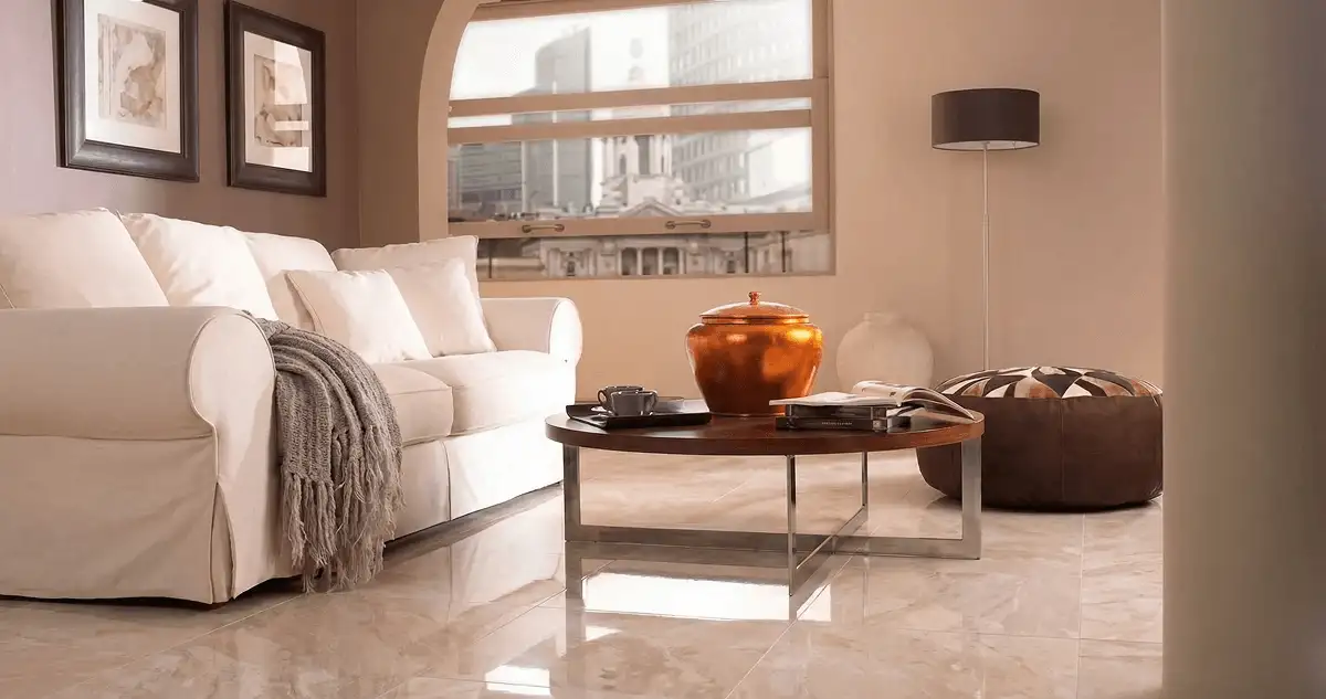 Modern living room with professionally installed marble flooring, a beige sofa, coffee table in Nashua, NH