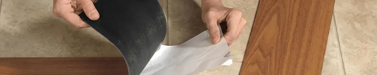 A professional installing vinyl flooring in Nashua, NH